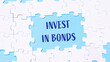 © Алла Морозова - Jigsaw puzzle with the words invest in bonds written in blue