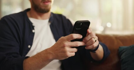Hands, phone and man on sofa in home with networking, contact or social media scrolling. Notification, technology and male person with cellphone for connectivity, online or mobile app in living room.