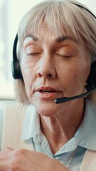 Poster - Mature woman, headset and customer service agent in office with online consultation for crm, help desk or advice. Audio tech, call center and female technical support consultant with troubleshooting.