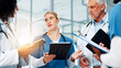 © peopleimages.com - Medical, tablet or question with doctors and nurses in hospital together for discussion or report. Healthcare, solution and teamwork with professional medicine team in clinic for diagnosis review