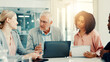 © peopleimages.com - Meeting, colleagues and group with laptop, discussion or investment idea in office or market trends. Corporate, financial analyst and people with tech for opportunity, talk and teamwork in boardroom