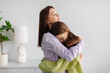 © Home-stock - Trust in parent-child relationship. Caring mother hugging her upset teen daughter, woman supporting child in difficult times, showing empathy and understanding