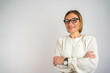 © Nenad - Happy relaxed confident mature businesswoman. Pretty middle aged business woman, successful confidence with arms crossed in financial building