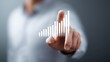 © KohXD - Individual holding a bar chart representing demand forecasting and projecting future needs for effective planning strategies