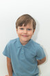 © Светлана Назарова - Little Boy in Blue Polo T-shirt on White Background, Child Student in Round Glasses