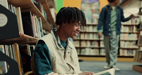 Poster - Happy man, student and reading with book in library on floor for education, learning or knowledge. Male person, learner or thinking with novel or solution for literature or studying by bookshelf