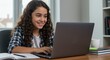 © SandraW - Photo of Smiling Girl Uses Laptop for Online Learning at Home
