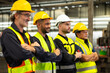 © NVB Stocker - Arms crossed. Professional team working at workplace. Unity and teamwork concept. Portrait engineer factory manager worker and mechanic team together in factory workplace