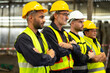 © NVB Stocker - Arms crossed. Professional team working at workplace. Unity and teamwork concept. Portrait engineer factory manager worker and mechanic team together in factory workplace