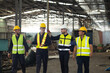 © NVB Stocker - Professional team working at workplace. Unity and teamwork concept. Group portrait engineer factory manager worker and mechanic team together in factory workplace