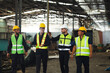 © NVB Stocker - Professional team working at workplace. Unity and teamwork concept. Group portrait engineer factory manager worker and mechanic team together in factory workplace