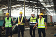 © NVB Stocker - Professional team working at workplace. Unity and teamwork concept. Group portrait engineer factory manager worker and mechanic team together in factory workplace