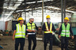 © NVB Stocker - Professional team working at workplace. Unity and teamwork concept. Group portrait engineer factory manager worker and mechanic team together in factory workplace
