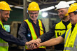 © NVB Stocker - team hands together. Professional team working at workplace. Unity and teamwork. Group portrait engineer factory manager worker and mechanic team together in factory workplace