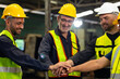 © NVB Stocker - team hands together. Professional team working at workplace. Unity and teamwork. Group portrait engineer factory manager worker and mechanic team together in factory workplace
