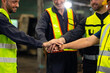 © NVB Stocker - team hands together. Professional team working at workplace. Unity and teamwork. Group portrait engineer factory manager worker and mechanic team together in factory workplace