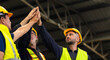 © NVB Stocker - team hands together. Professional team working at workplace. Unity and teamwork. Group portrait engineer factory manager worker and mechanic team together in factory workplace