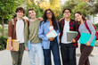 © EFStock - Portrait of cheerful international exchange University students looking at camera smiling outdoors together laughing after lectures