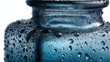 © Thanakorn - Close-up of a wet glass jar covered in water droplets with a blurred background showcasing condensation on the surface