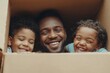 © Kabr - Portrait of happy father playing with two sons in cardboard box while family moving to new house, copy space