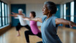 © Curioso.Photography - Older adults practicing yoga in a studio, focusing on balance and breathing in warrior pose.