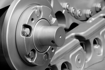 Poster - Tractor track on roller close up machine part many bolts and screws сoncept complexity precision, many parts fasteners work together create functioning machine