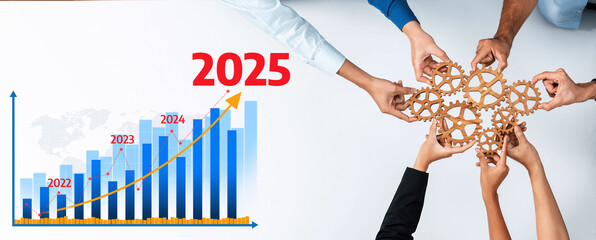 Fototapete - This image showcases teamwork for business success with hands collaborating around a gear structure, accompanied by a growth chart projecting future metrics up to 2025. Amity