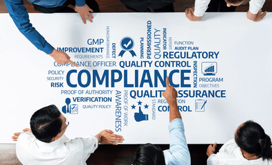 Aufkleber - A diverse group of professionals collaborates in a compliance workshop, analyzing essential quality assurance concepts and regulations ensuring strict adherence to industry standards. Amity