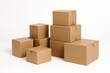 © Jelena - Stack of Assorted Sizes of Plain Brown Cardboard Shipping Boxes Ready for Packing and Moving Isolated on White