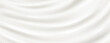 © klyaksun - Milk or silk cream texture with smooth flowing waves - white liquid surface with elegant folds and soft ripples. Luxurious dairy product background for cosmetic or food design presentations.