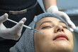 © Jack Tamrong - Close up beautician injecting filer into Asian woman cheek for face treatment in beauty clinic