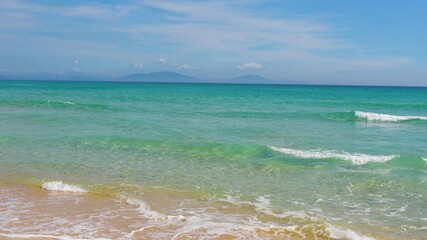 Wall Mural - Landscape of the morning beach with turquoise water and light suns at low tide