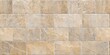 © MD - Natural Beige Tan Stone Brick Wall Texture with Staggered Pattern and Subtle Marble Veining for Rustic and Modern Architectural Surfaces