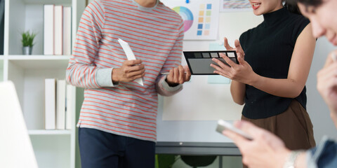 Wall Mural - collaborative ux ui design discussion. team members exchanging ideas on design elements.