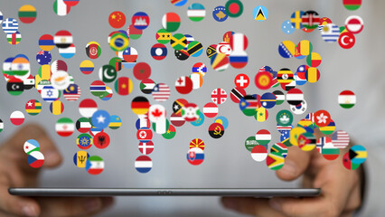 Aufkleber - Image of a tablet displaying numerous flags, representing global reach and international connections.