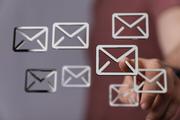 Leinwandbilder - Efficient email management.  Concept image showing digital email icons and a hand interacting.