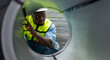 © PINA - engineer worker check and inspect stainless galvanized metal sheet roll in warehouse for production supply, black man people in safety vest and helmet working at industrial manufacturing factory
