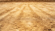 © Bonsales - Compacted sand surface with tire tracks, prepared for building a concrete apron, showcasing construction site preparation