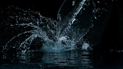 Aufkleber - Clear water splash on a black background , close-up