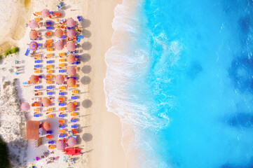 Wall Mural - summer vacation and rest. beach, people and umbrellas. top view from drone at the beach and azure se