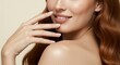 © Ilyas - A woman applying nail polish to her nail, a fashion concept used