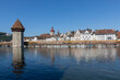 © grahammoore999 - Lucerne Chapel Bridge and riverfront sunny day logos removed
