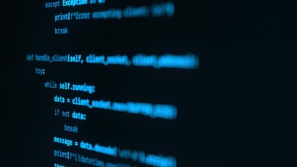 Close up view of blue programming code running on a computer screen. Concept of software engineering, and application development
