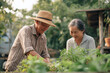 © Sukifli Dakheng - Elderly Thai couple garden. They look happy and content