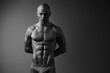 © SHOTPRIME STUDIO - Black and white portrait of a muscular man showcasing strength and confidence. Emphasizing sculpted physique, dramatic lighting creates a striking visual impact.