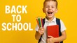 © iPhoto - Back to school supplies happy student education learning schoolboy smile