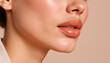 © Yosich1961 - Close-up of woman’s lips with glossy finish against neutral backdrop - Concept of Summer skincare