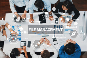 Fototapete - A diverse team collaborates on file management solutions in a modern office, utilizing technology for effective data organization and project success. Amity