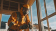 © LorelEino - Worker in Protective Gear Adjusting Equipment Near Large Window
