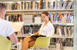 © JackF - Students sit in chairs and study literature in reading room. Learners work with printed sources of information, work with periodicals and scientific articles, study for exam.